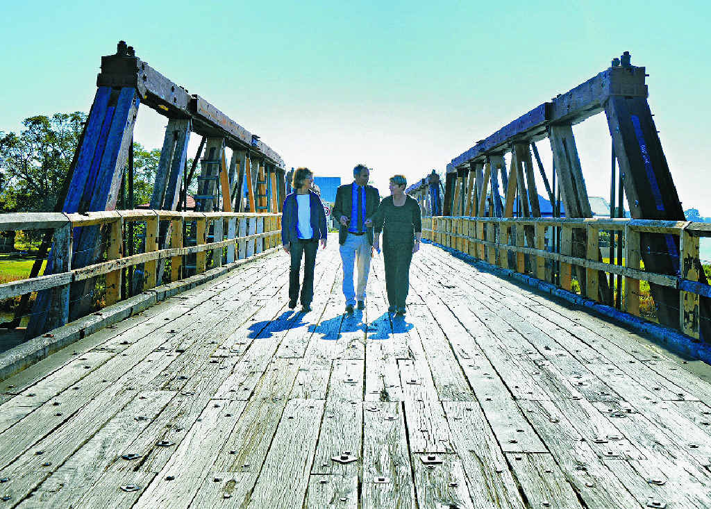 WAIT IS OVER: Clarence MP Chris Gulaptis walks with Lawrence bridge campaigners Di Ensbey (left) and Sally Hoy (right) and discusses the new bridge for Sportsmans Creek. Photo Georja Ryan WAIT IS OVER: Clarence MP Chris Gulaptis walks with Lawrence bridge campaigners Di Ensbey (left) and Sally Hoy (right) and discusses the new bridge for Sportsmans Creek. Photo Georja Ryan